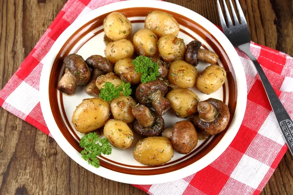 Brown mushrooms fried with round potato — Stock Photo, Image