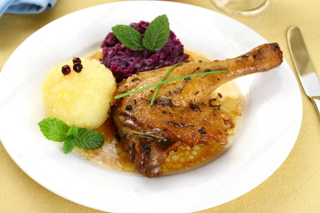 Duck leg with potato dumplings, red cabbage and gravy