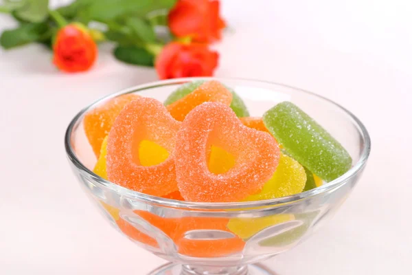 Colored candies with two red hearts in glass bowl — Stock Photo, Image