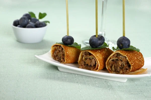 Pancake roll stuffed with minced meat as snack — Stock Photo, Image