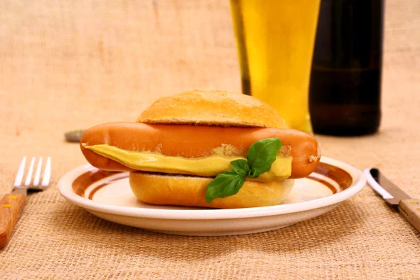 German sausage with bun, mustard and beer — Stock Photo, Image