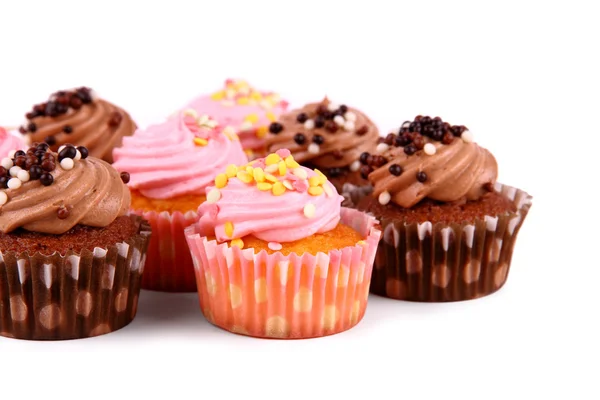 Chocolate and pink cup cakes with deco balls — Stock Photo, Image