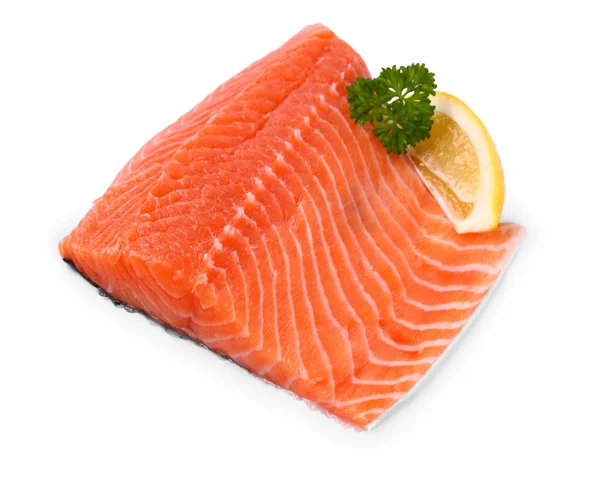 Raw, red salmon fillet with lemon wedge — Stock Photo, Image