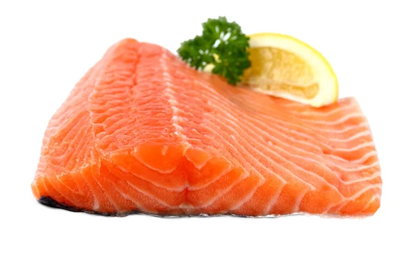 Raw, red salmon fillet with lemon wedge — Stock Photo, Image
