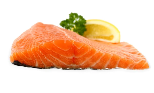 Raw, red salmon fillet with lemon wedge, frontal — Stock Photo, Image