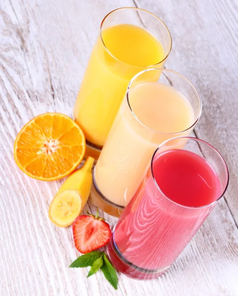 Fruity drinks juice from banana, tangerine, strawberry — Stock Photo, Image