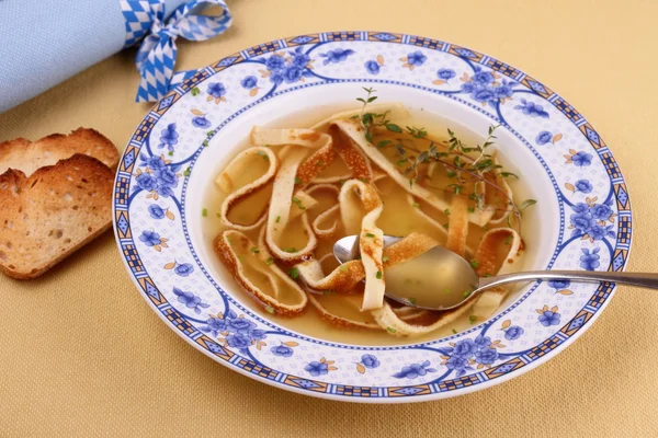 Pancake soup in blue plate, eating — Stock Photo, Image