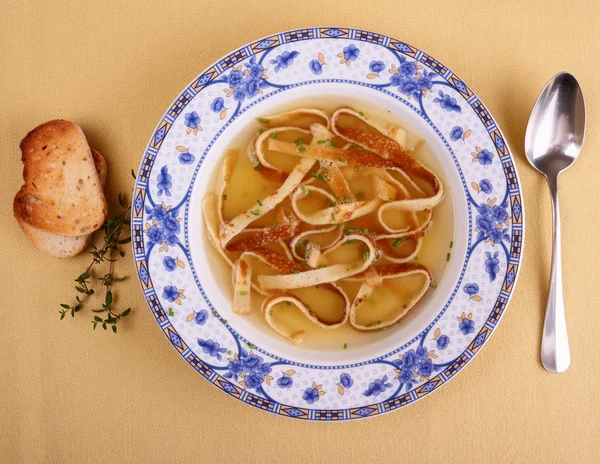 Pancake soup in blue plate with bread — Stock Photo, Image