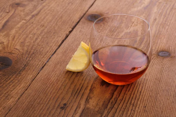 Luxury Cognac in decorative glass with lemon — Stock Photo, Image