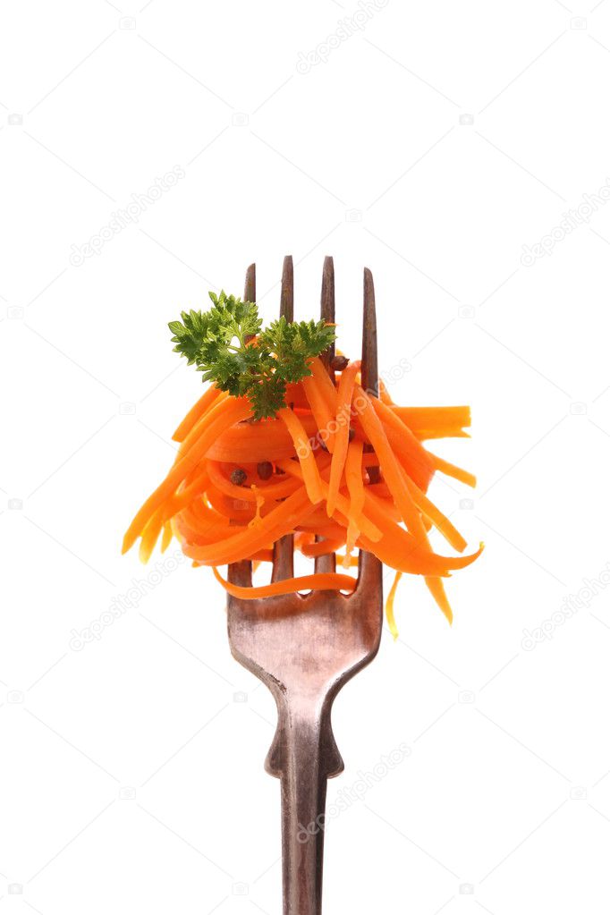 Carrot salad on fork with parsley, isolated