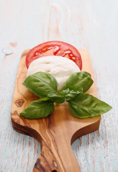 Basil leaf, mozzarella cheese and tomato slice — Stock Photo, Image