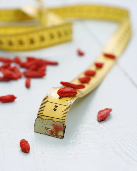 Goji berries and tape measure, concept of health, soft focus — Stock Photo, Image