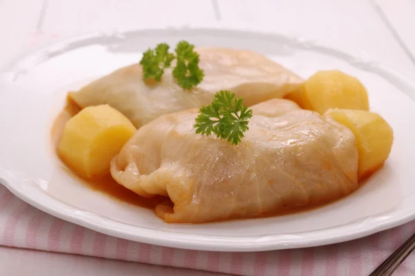 Cabbage rolls with potato, parsley and sauce — Stock Photo, Image