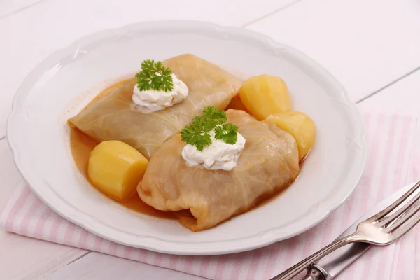 Cabbage rolls with potato and sour cream — Stock Photo, Image