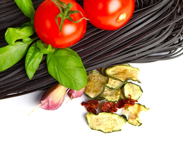 Italian Pasta with vegetables in wooden plate isolated on white — Stock Photo, Image