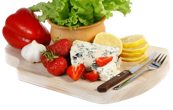 Strawberries and cheese on a wooden plate — Stock Photo, Image