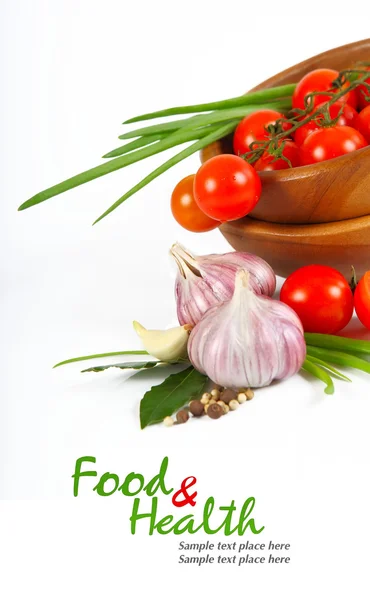 Cherry tomatoes and garlic on white background. — Stock Photo, Image