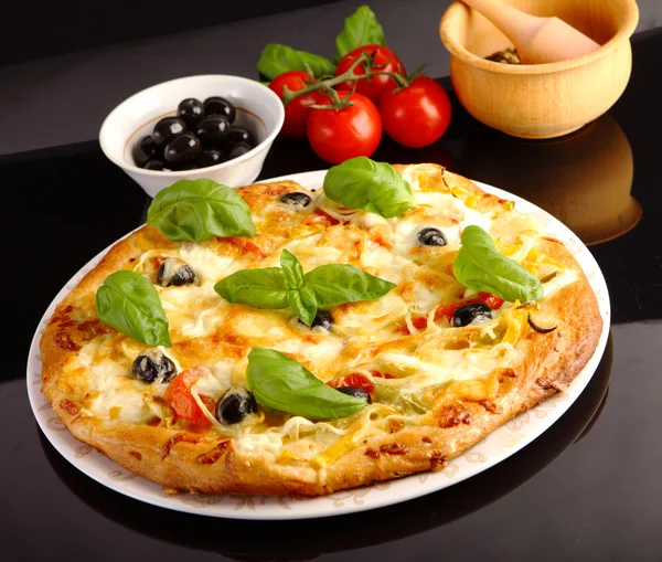 Pizza in black — Stock Photo, Image