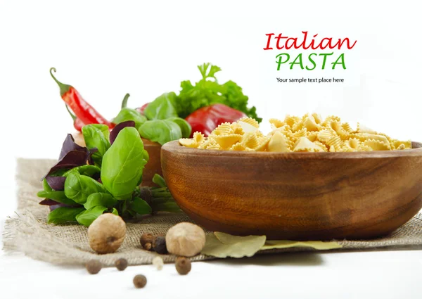 Italian Pasta with vegetables in wooden plate — Stock Photo, Image