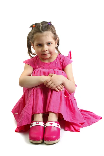 Una bella bambina in abito rosa — Foto Stock