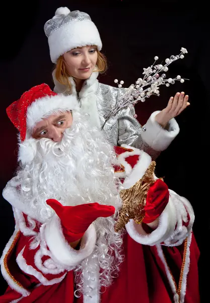 Santa Claus y doncella de nieve — Foto de Stock