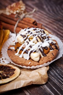 Coffee cakes with chocolate, spices and coffee seeds, close up
