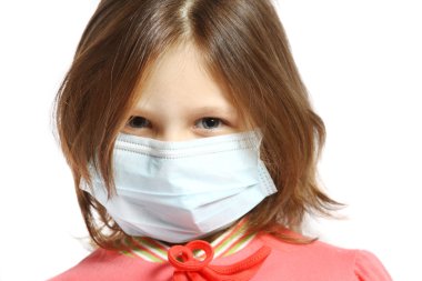 Little girl wearing a protective mask