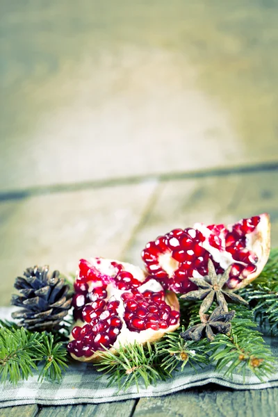 Pomegranate fruit on wooden background — Stock Photo, Image
