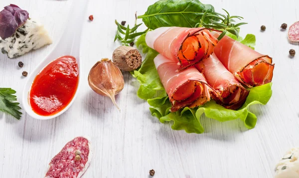 Prosciutto in white background — Stock Photo, Image