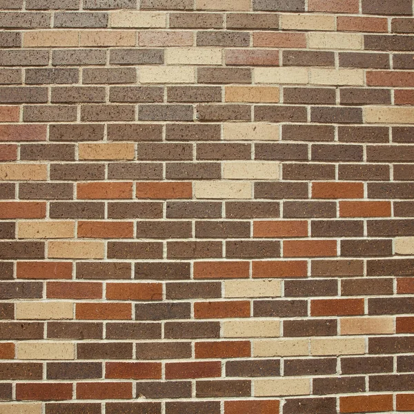 background texture. brick wall with red bricks and brown paint on a white stone.