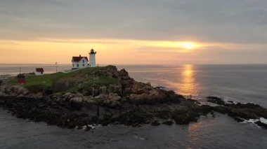 Nubble Lighthouse along the coast of Maine at sunrise. 