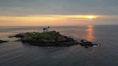 Nubble Lighthouse along the coast of Maine at sunrise. 