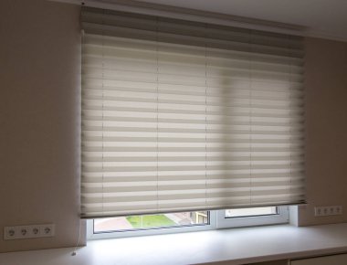 Pleated blinds XL Coulisse, white color, with 50mm fold close up in the window opening in the interior. Luxury sun protection and window decoration. Modern shades. clipart