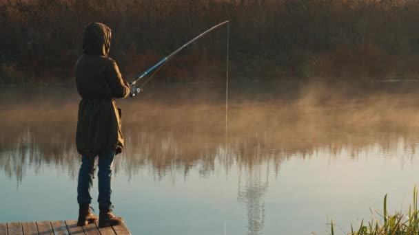 Fisherman enjoy hobby at the riverside — Stock Video