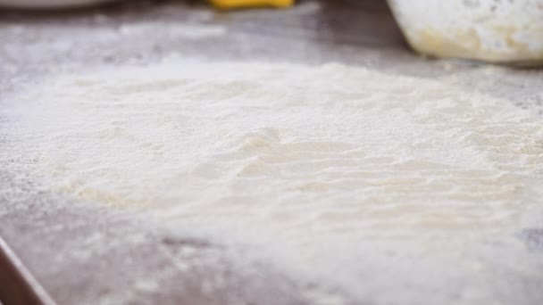 Close Shot Dough Falling Work Surface Thin Layer Flour Slow — Vídeo de Stock