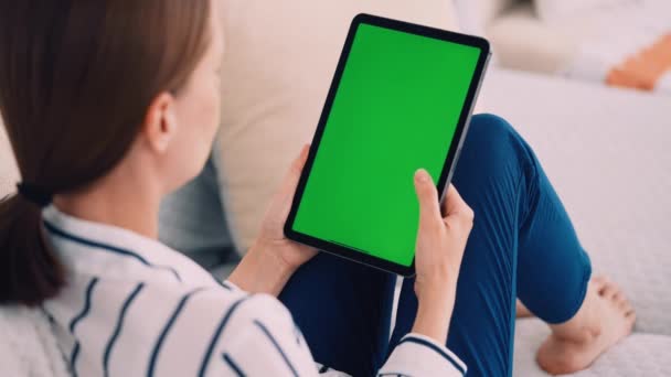 Woman Sitting Sofa Holding Digital Tablet Vertical Scrolling Green Screen — Stock Video