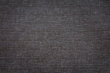 szerkezetű, durva szürke szövet.