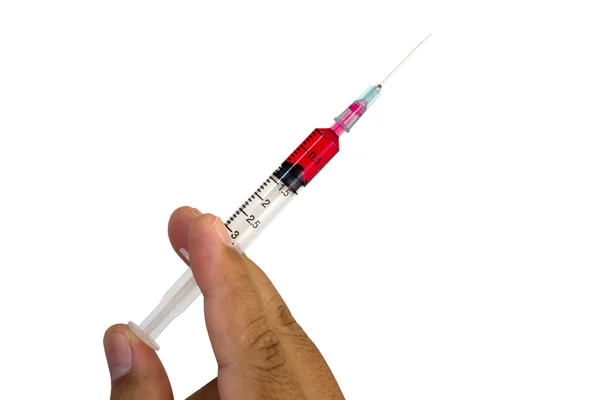 Syringe in hand, isolated on white background — Stock Photo, Image