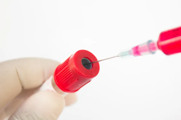 Syringe and plastic Test Tube in hand. — Stock Photo, Image