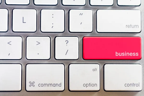 Біла клавіатура і бізнес-кнопка — стокове фото
