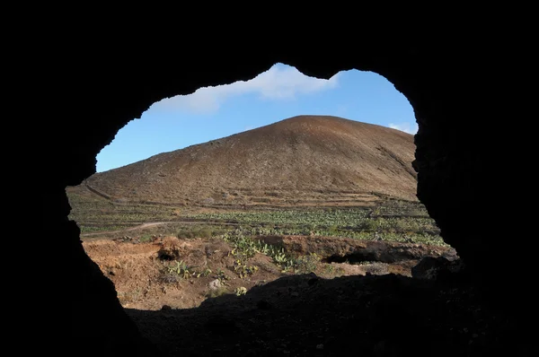 Cave near a volcano in the desert — Stock Photo, Image