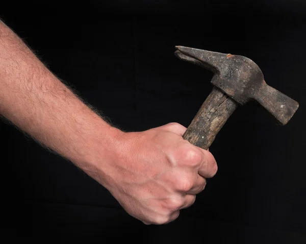 Mano e antico martello — Foto Stock