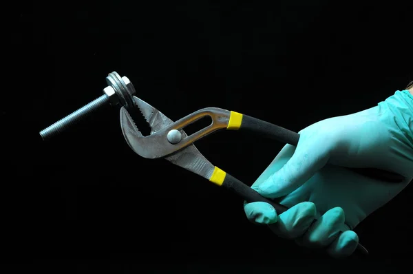 Pliers and a Hand — Stock Photo, Image