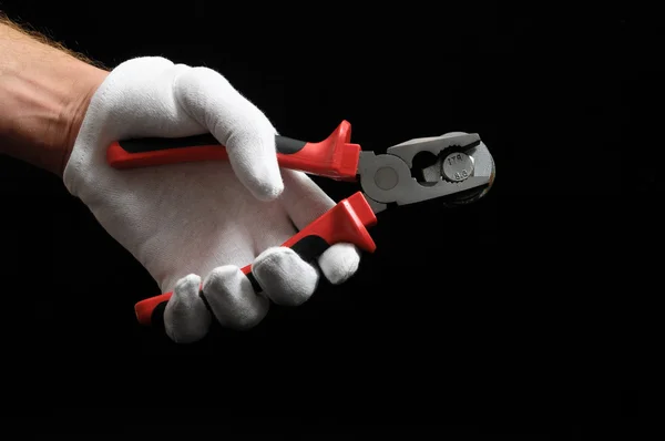 Pliers and a Hand — Stock Photo, Image