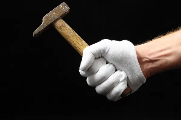 Hammer and a Hand — Stock Photo, Image