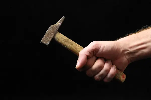 Hammer and a Hand — Stock Photo, Image