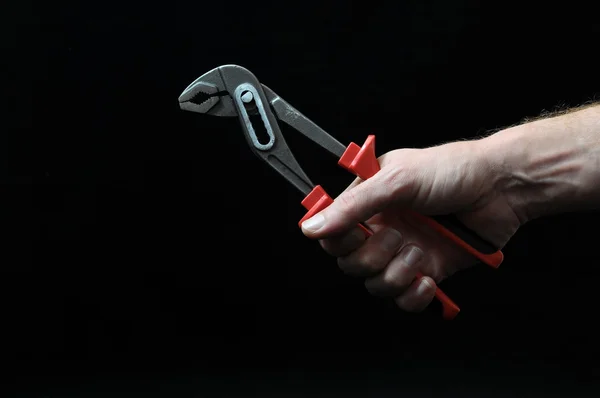 Pliers and a Hand — Stock Photo, Image