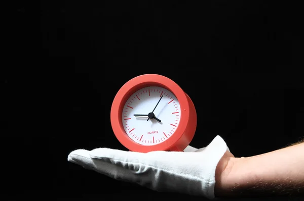 Reloj y una mano — Foto de Stock