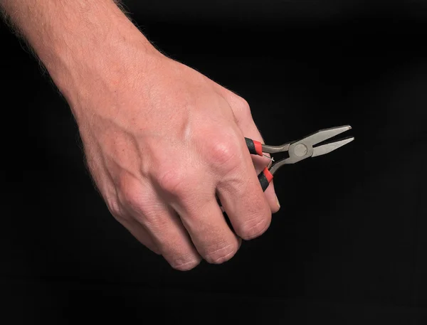 Hand and Tongs — Stock Photo, Image