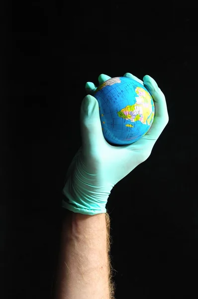 Planeet aarde en een hand — Stockfoto